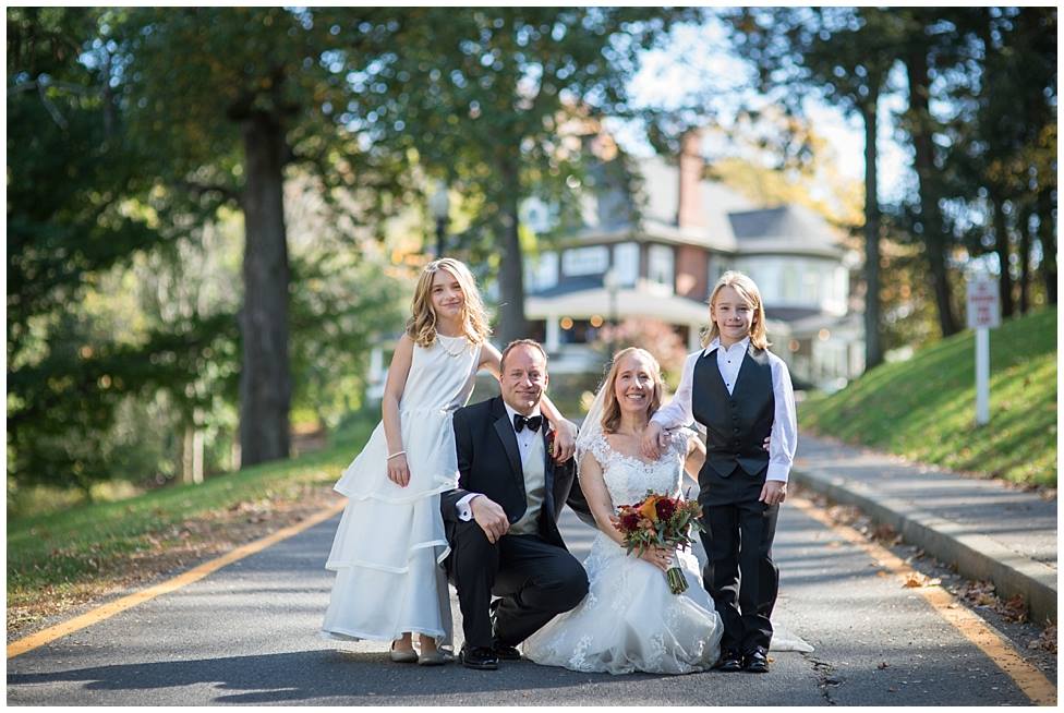 Weddings at Tarrywile Mansion bride, groom and kids in front of mansion