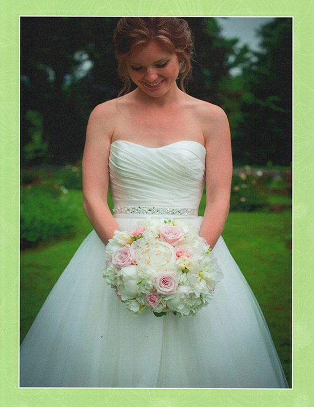 brochure-page-three-bride-looking-down-at-bouquet