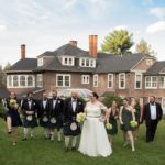 Day Two of Triple Header wedding-party-posing-on-back-lawn