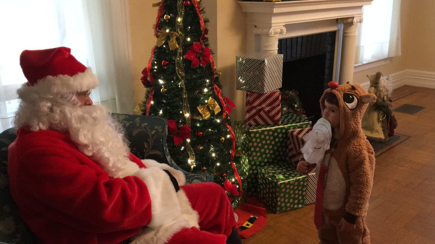 Candy Cane Hunt Fundraiser santa-with-child-in-reindeer-costume